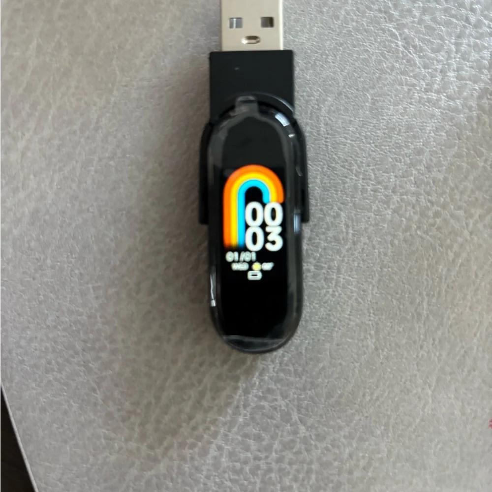 Black Fitness Tracker with Sleek Design and Wristband